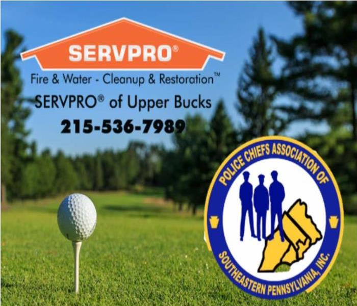 A picture of a golf ball teed up with the SERVPRO logo and Police Chiefs Association of Southeastern PA logo